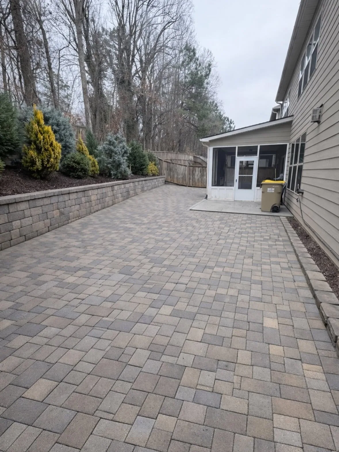 Wide paver patio block retaining wall screened porch loganville